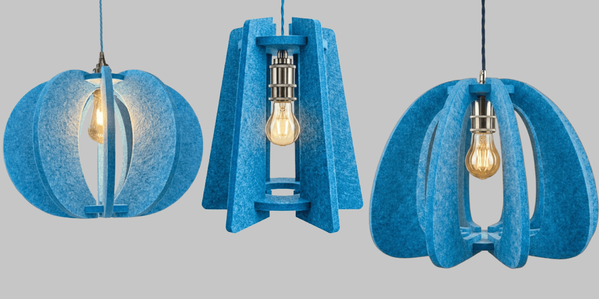 Three blue pendant lights with a gray background