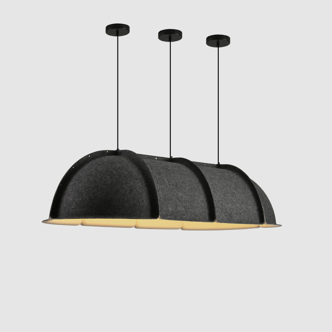 A modern pendant modular light with overlapping dome-like sections, in a gray color, with visible black support rods and a yellow-tipped light source.