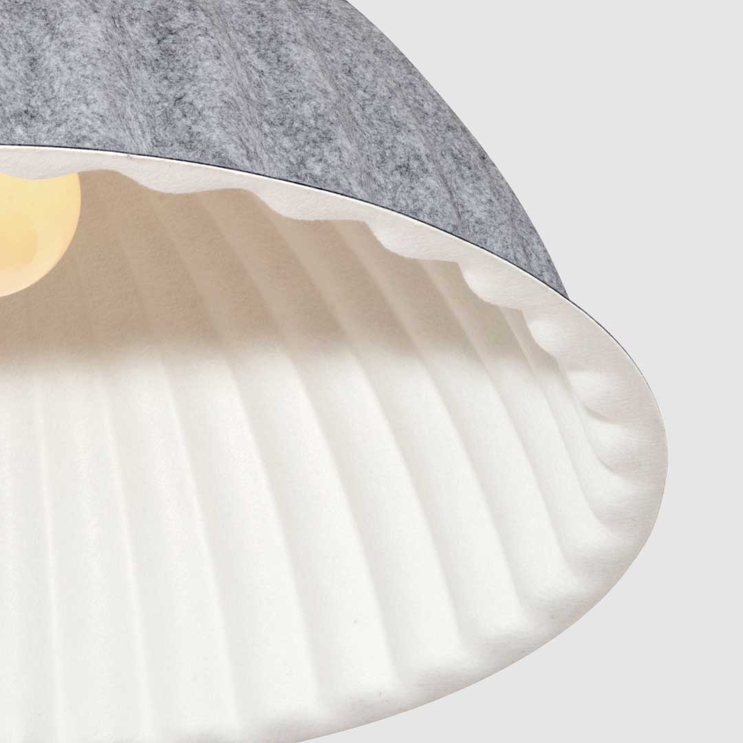 Close up of the ribbed detailing on the grey acoustic ribed ceiling fitting.