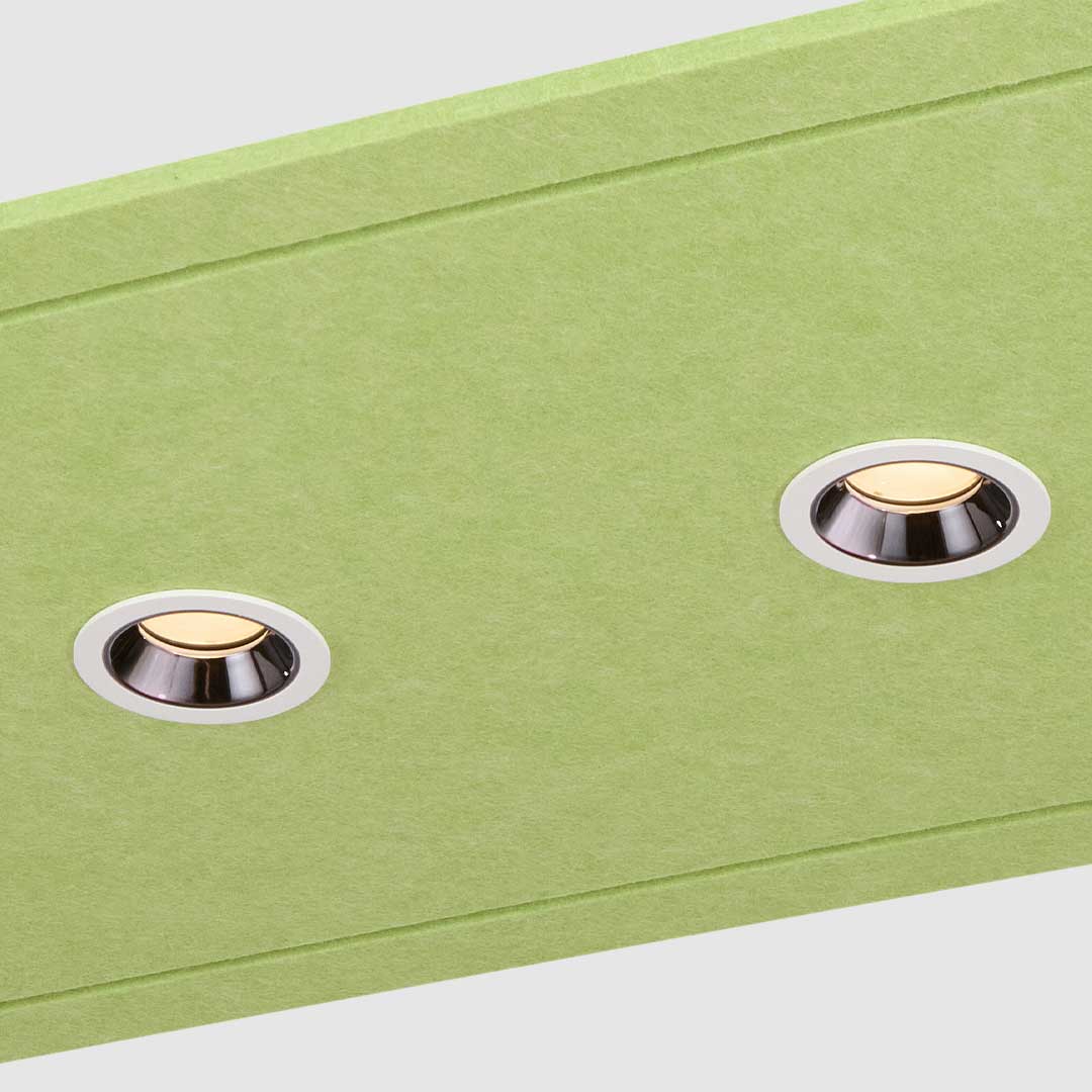 Close up of a green acoustic raft ceiling light with 4 downlights.